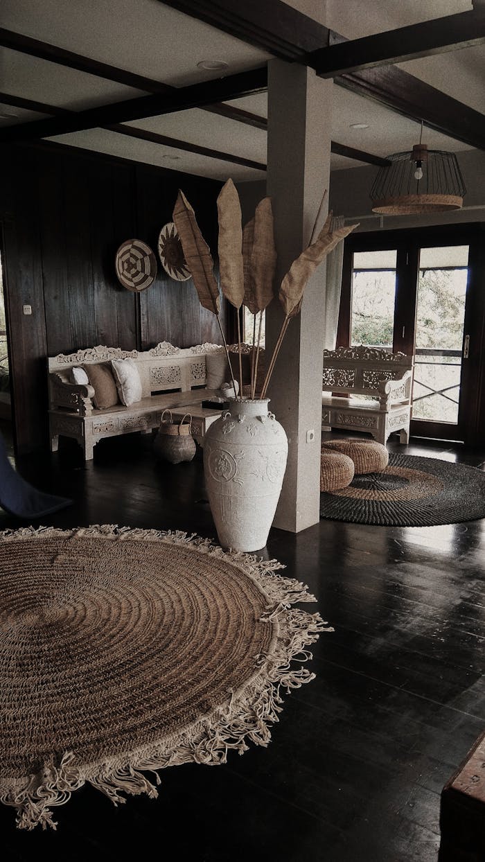 Cozy rustic living room with natural decor and vintage furniture, bathed in sunlight.